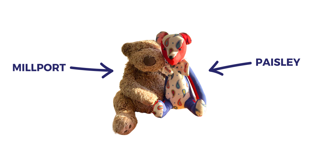 Two teddies are posed together - the left one scruffy and brown, and the right one a colour mix of blue, red and paisley-patterned material. A blue arrow and text labels the left as Millport, and the right as Paisley.